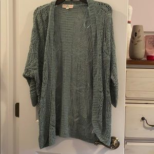 Sage/olive colored 3/4 sleeve cardigan. Size M